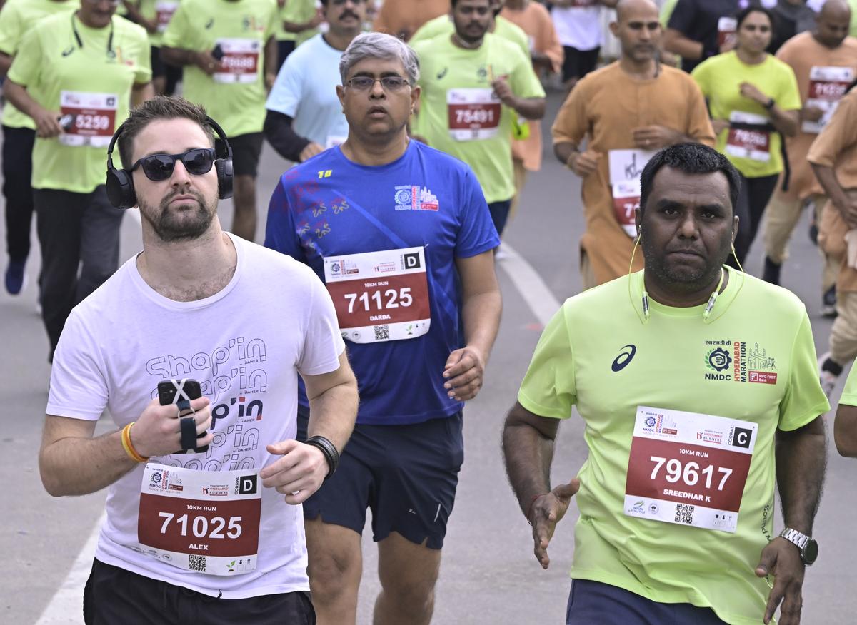 Runners in action during the 14th edition of the NMDC Hyderabad Marathon in Hyderabad on Saturday.