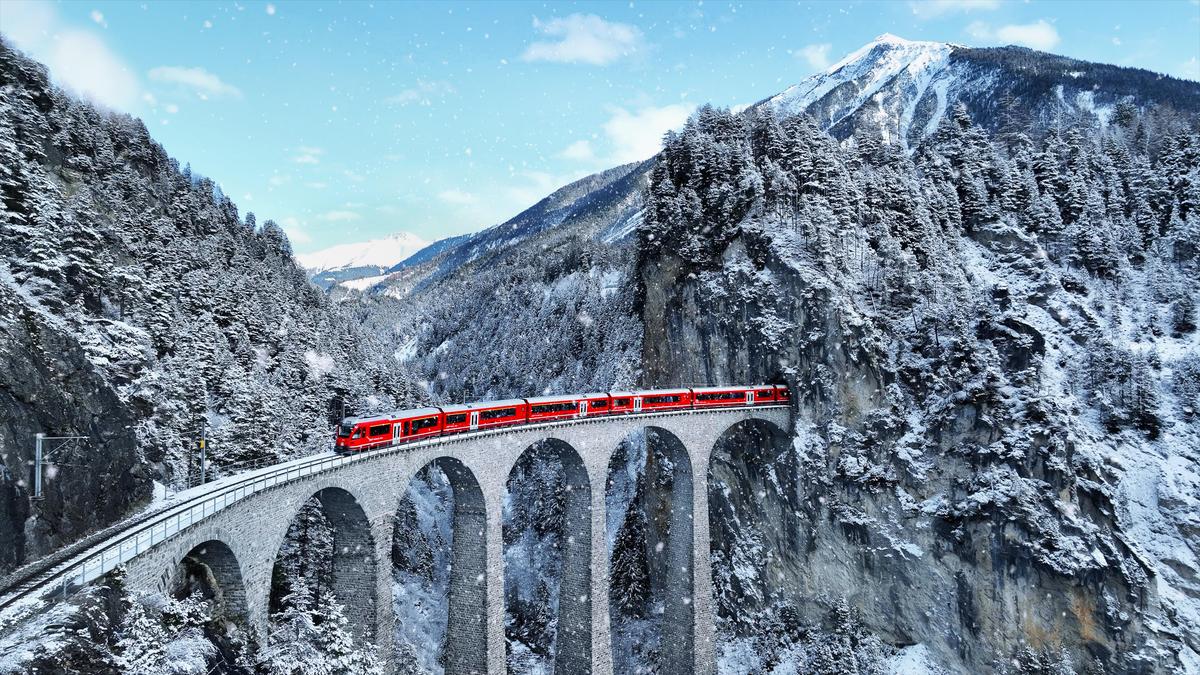 A train passing through the Landwasser viaduct in Switzerland A train passing through the Landwasser viaduct in Switzerland