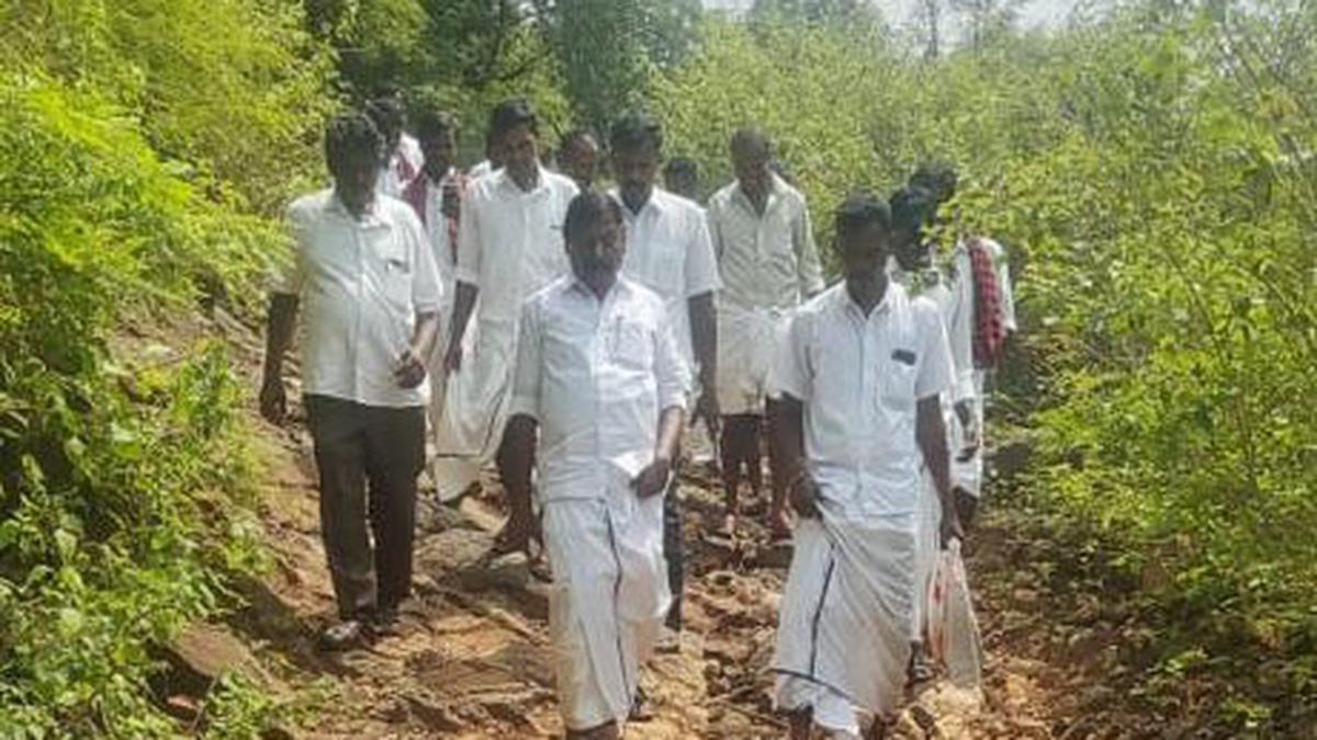 Anthiyur MLA walks 10 km through forest to reach village on T.N.-Karnataka border, listens to residents’ grievances