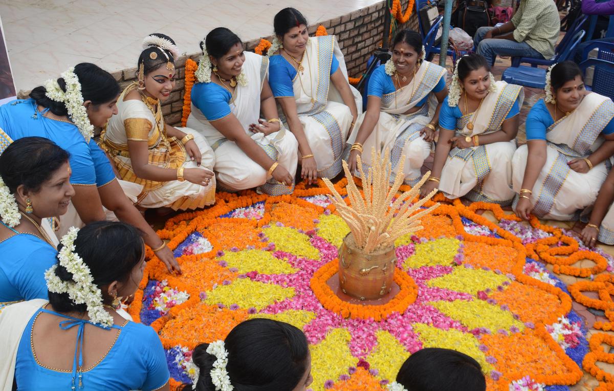 Women arranging pookalam