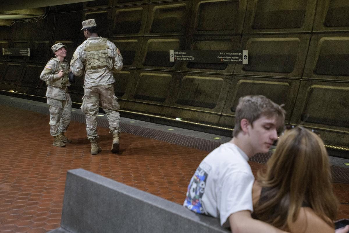 Members of the South Carolina National Guard patrol the platform of the Washington Metro Gallery Place station in Washington, on Sunday, August 24, 2025.