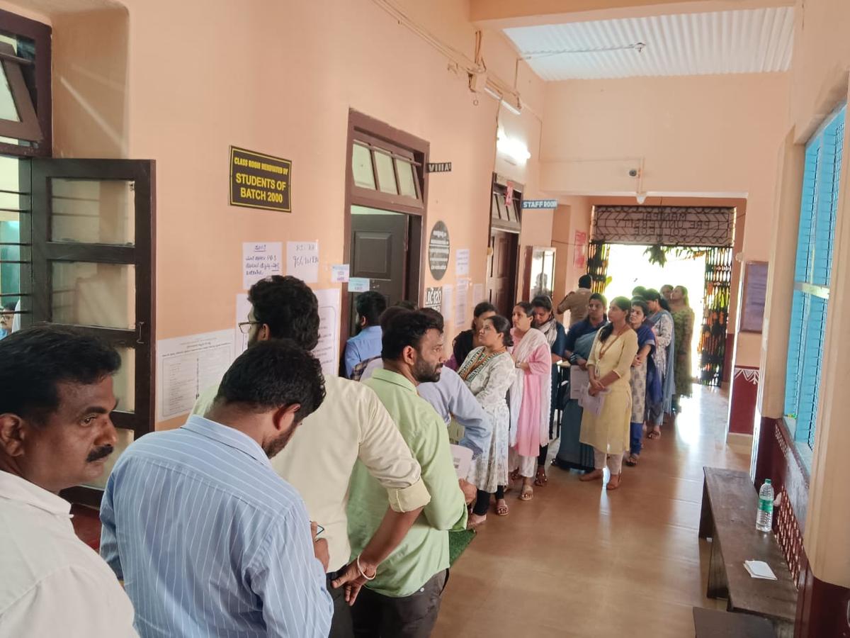 Voters gathered at a polling booth at​ Board High School during Legislative Council elections, in ​Udupi on Monday.