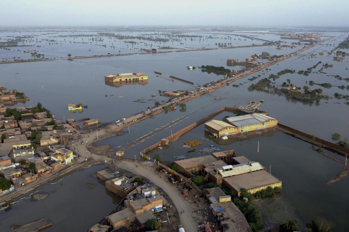 Homes are surrounded by floodwaters in Sohbat Pur city, a district of Pakistan’s southwestern Baluchistan province, Aug. 29, 2022. 