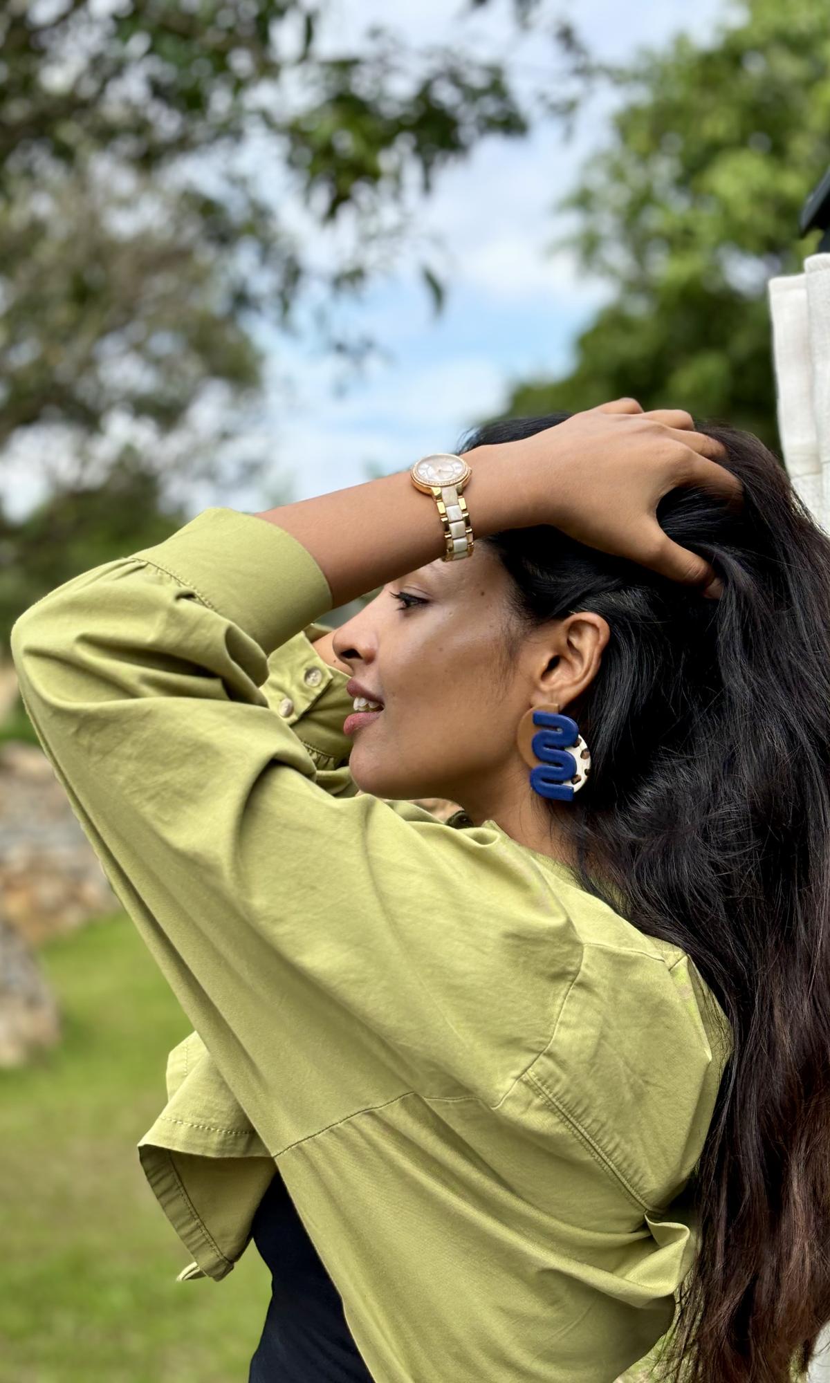 Meghana wearing one of her earrings 