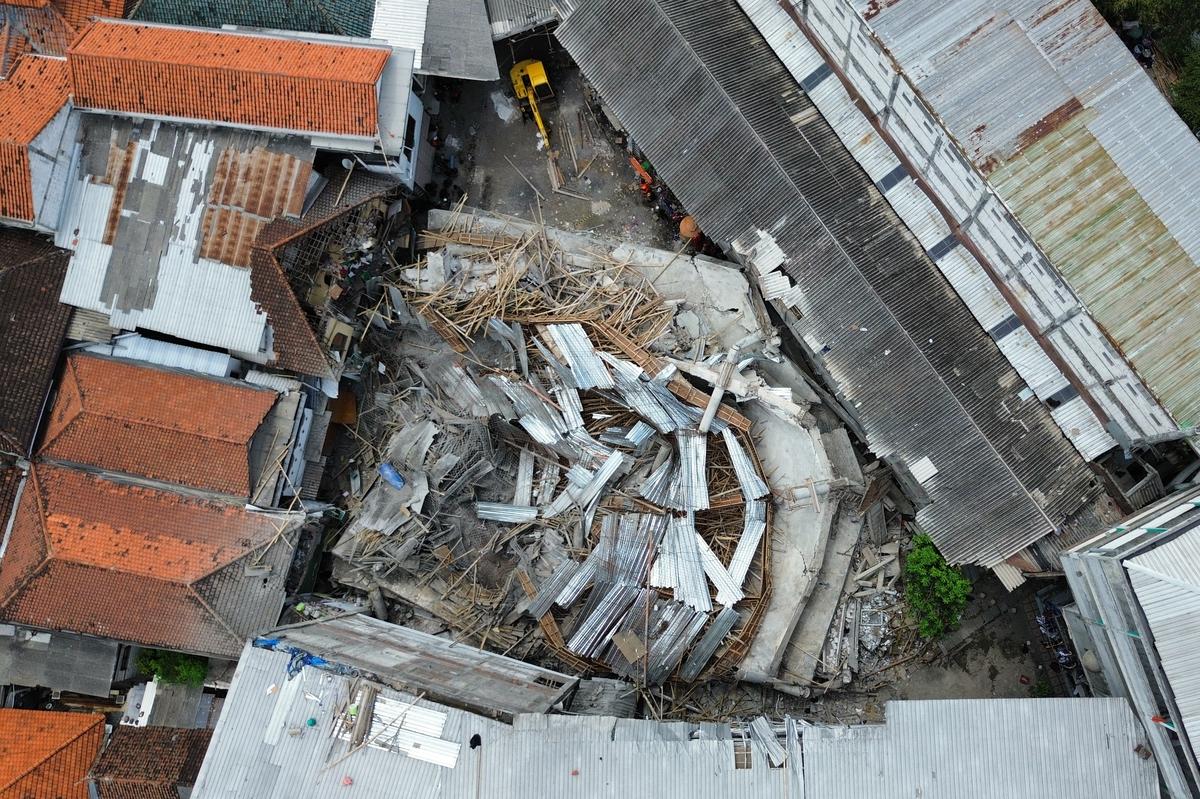 This aerial shot taken with a drone shows the rubble of a building that collapsed at the compound of an Islamic boarding school in Sidoarjo, East Java, Indonesi.