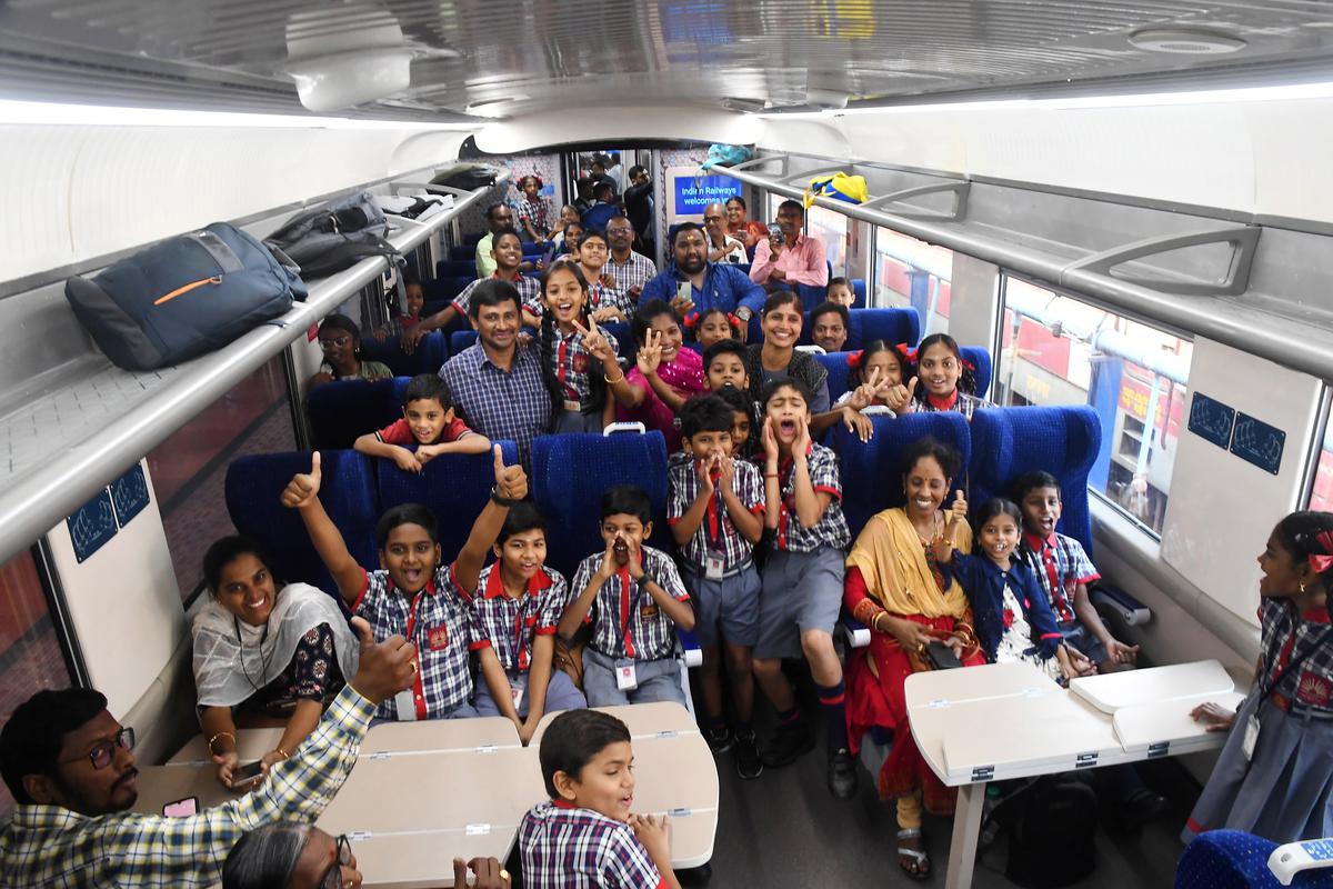 Schoolchildren thoroughly enjoying the ride on the Visakhapatnam - Bhubaneswar Vande Bharat express, in Visakhapatnam on Tuesday. 