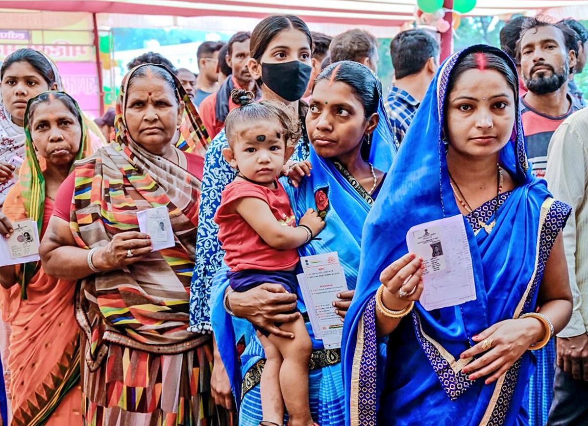 Voters at polling booths in Jharkhand.