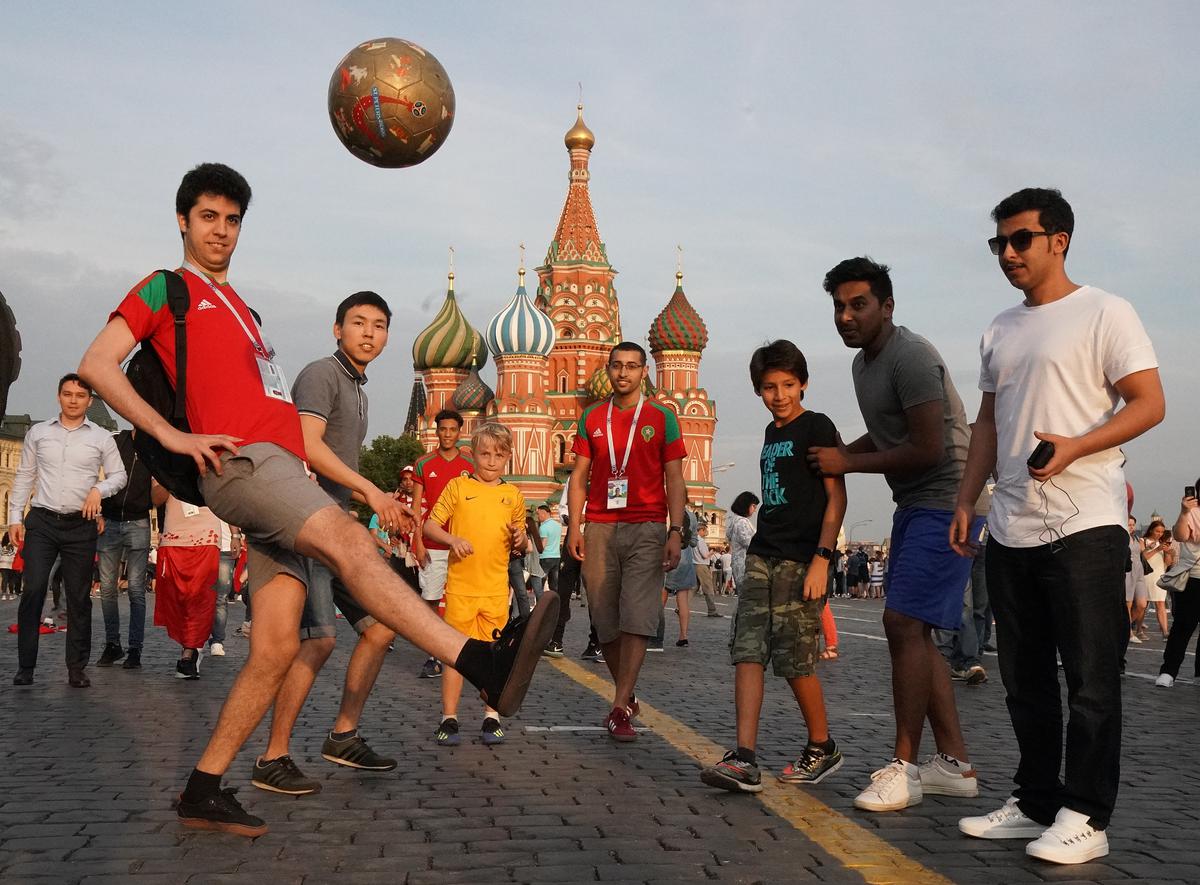Football fans of different nationalities at Moscow’s Red Square during the 2018 FIFA World Cup in Russia.