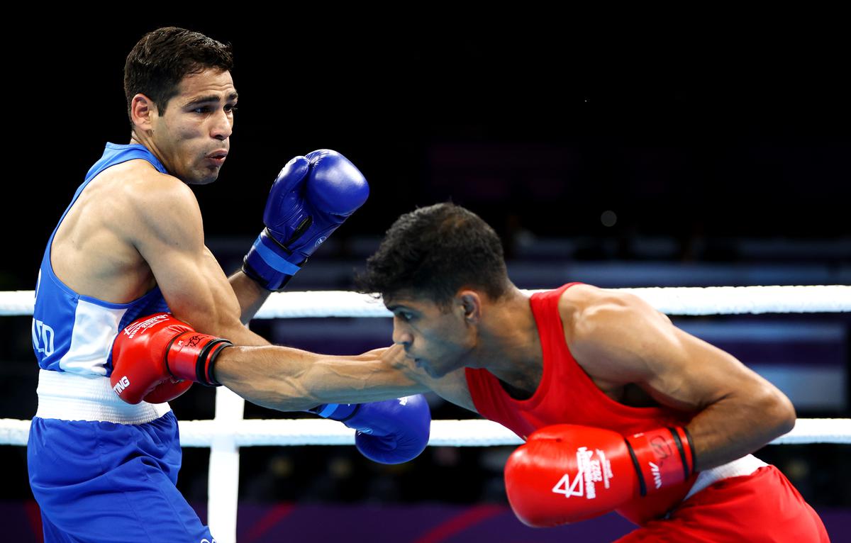 India’s Hussamuddin Mohammed and Md Salim Hossain of Bangladesh exchange punches during their men’s over 54kg- 57kg (featherweight)  Round of 16 fight on day four of the Birmingham 2022 Commonwealth Games at the NEC Arena on August 01, 2022.