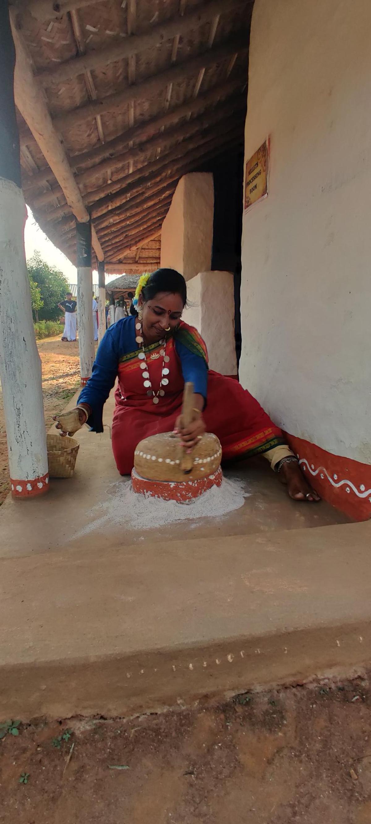 A visitor experiencing the adivasi lifestyle at Giri Grama Darshini at Pedalabudu near Araku, 130 kilometres from Visakhapatnam.