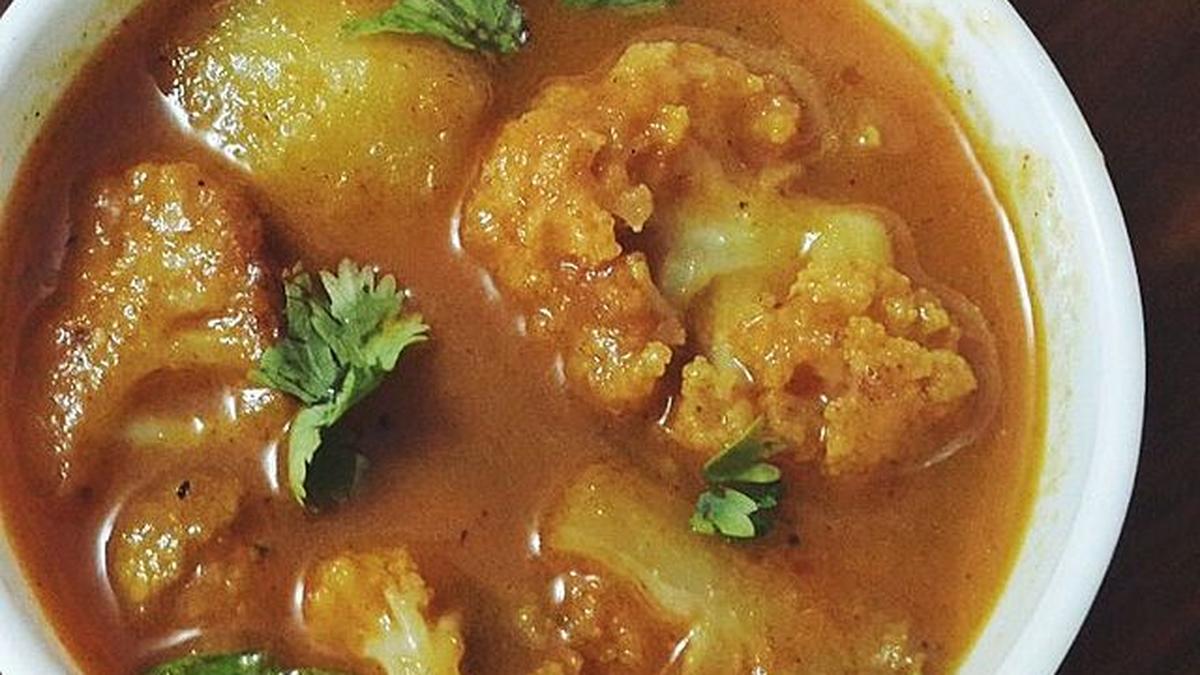 Savor the rich flavors of cauliflower leaves, stem, and potato curry in
