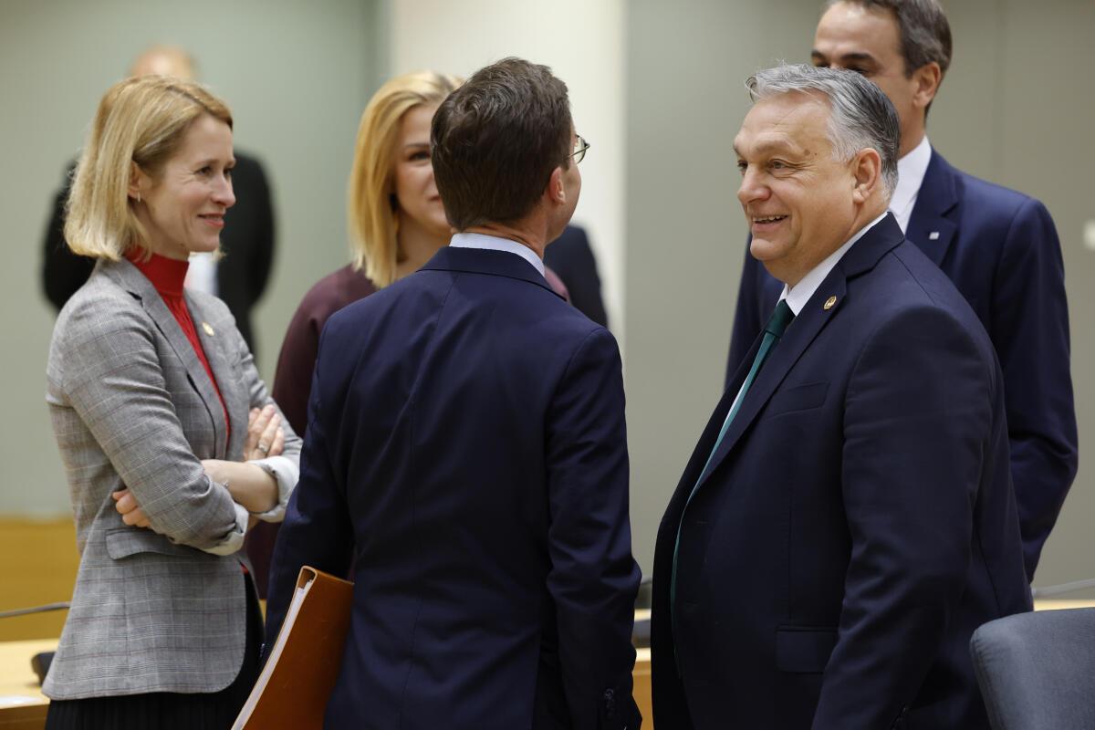Hungary’s Prime Minister Viktor Orban, right, talks to Finland’s Prime Minister Petteri Orpo, center, next to Estonia’s Prime Minister Kaja Kallas, left, during a round table meeting at an EU summit in Brussels, Thursday, Feb. 1, 2024.