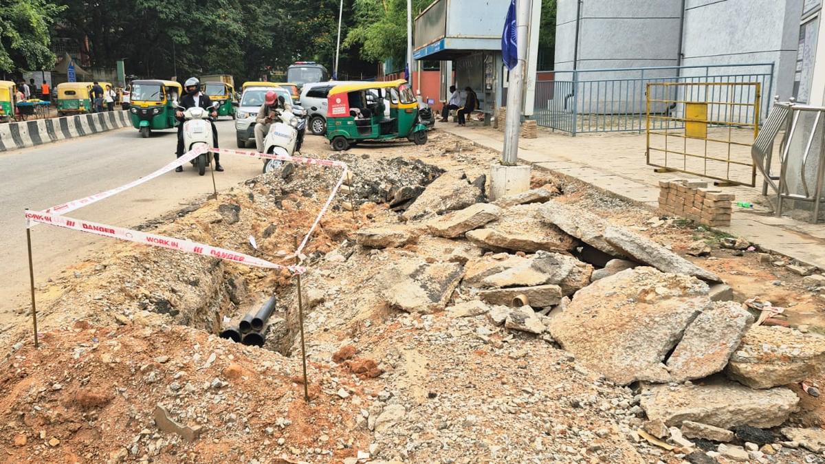 Pedestrians struggle as footpath remains in shambles in heart of Bengaluru