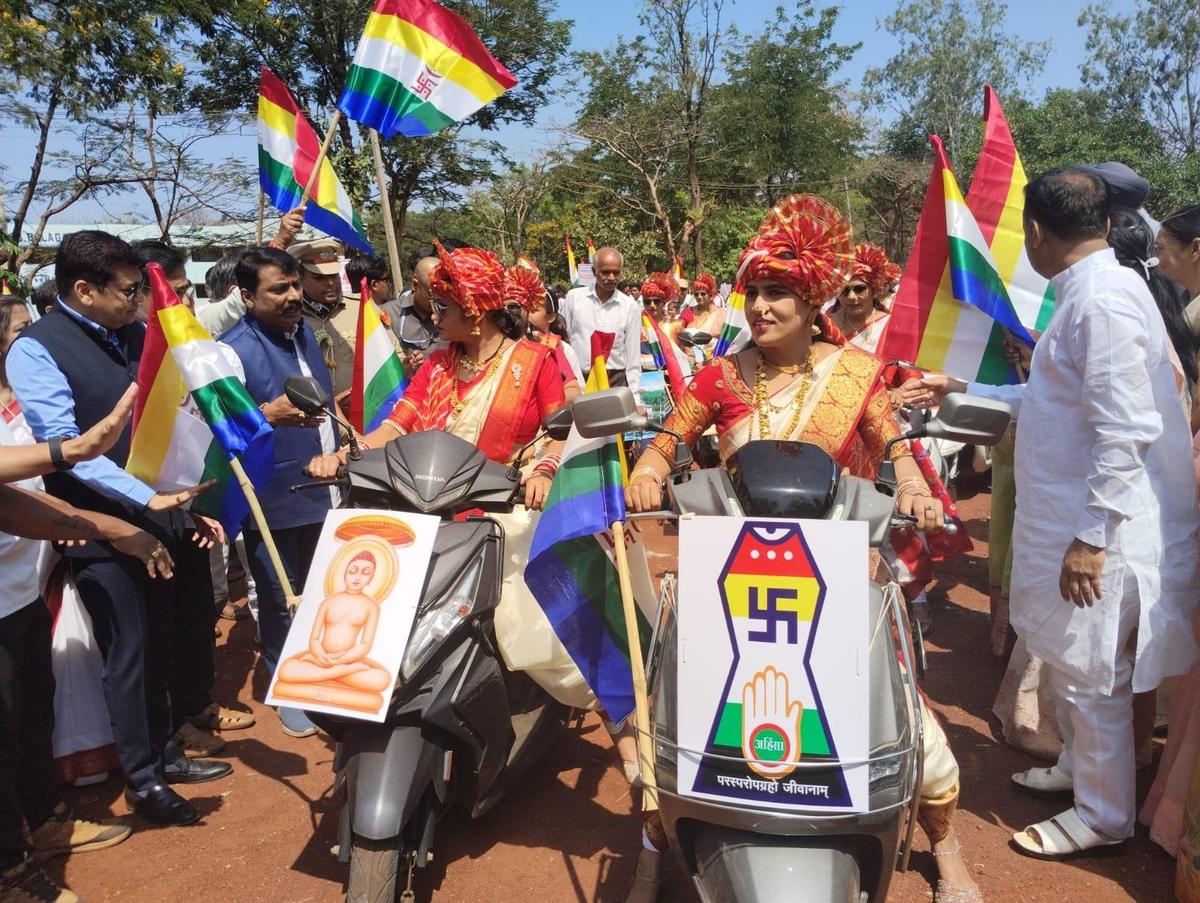 Women participating in a bike rally, Ahimsa Yatra, to mark Mahavira Janma Kalyanaka in Belagavi on Sunday.