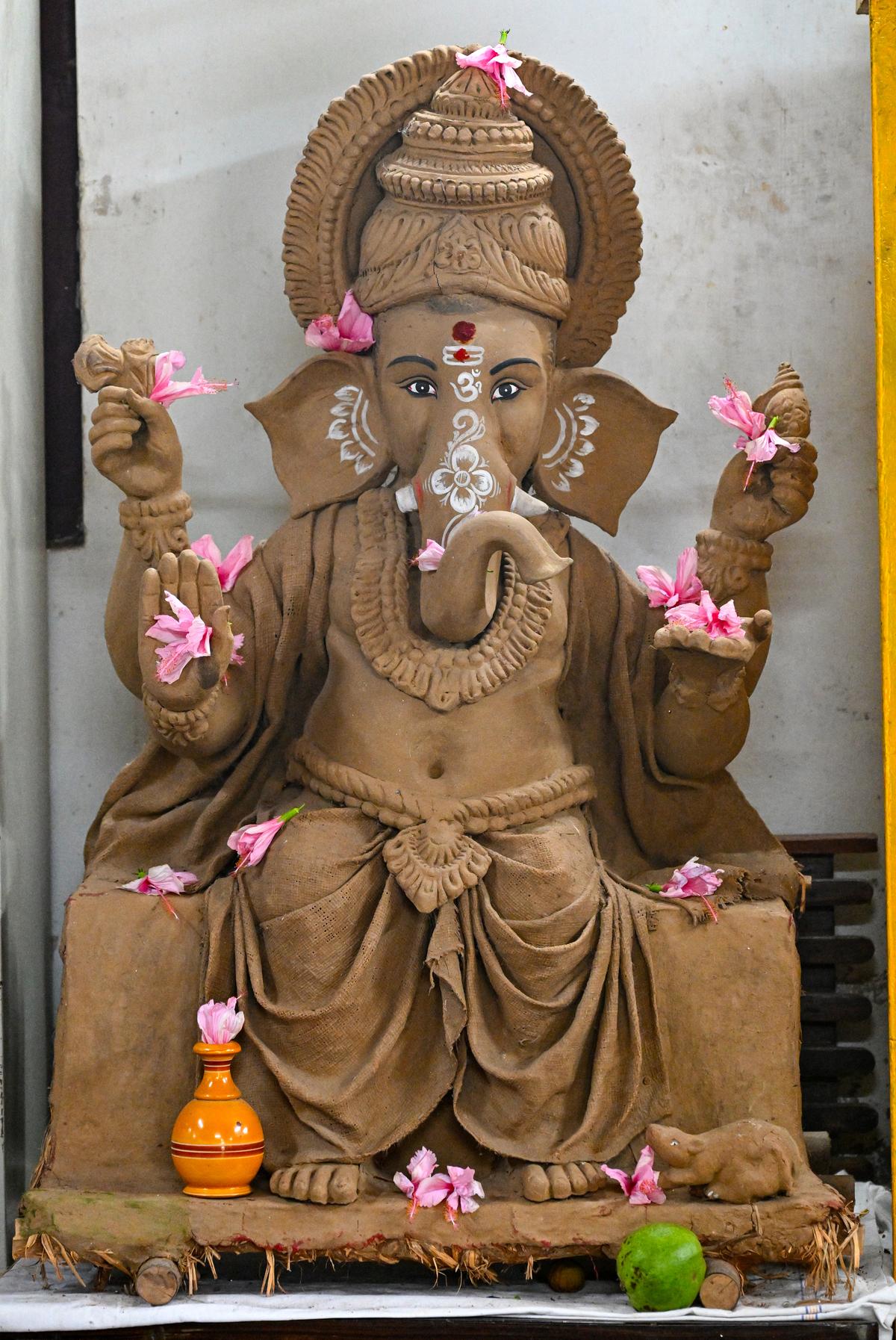 Idol makers from West Bengal making Ganesha idols with clay at a makeshift workshop at Sankalpa Art Village in Pedagadi near Visakhapatnam. Idol makers from West Bengal making Ganesha idols with clay at a makeshift workshop at Sankalpa Art Village in Pedagadi near Visakhapatnam.