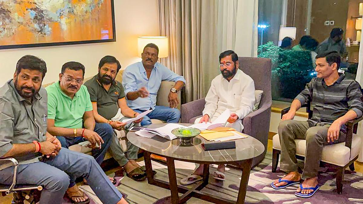 Rebel Shiv Sena leader Eknath Shinde with other MLAs at a hotel in Guwahati