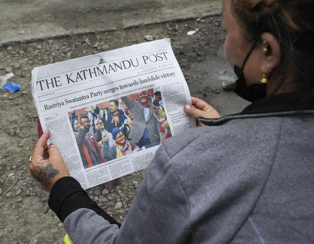 A woman reads a newspaper carrying reports on the landslide victory of Balendra Shah in general elections, in Damak, Jhapa, Nepal, Sunday, March 8, 2026. Shah defeated four-time former prime minister KP Sharma Oli by a margin of about 50,000 votes in the Jhapa-5 constituency. A woman reads a newspaper carrying reports on the landslide victory of Balendra Shah in general elections, in Damak, Jhapa, Nepal, Sunday, March 8, 2026. Shah defeated four-time former prime minister KP Sharma Oli by a margin of about 50,000 votes in the Jhapa-5 constituency.