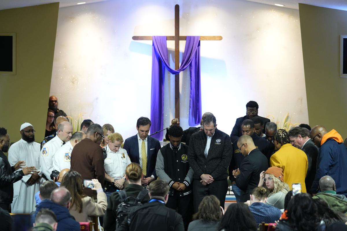 People pray for officials including Baltimore Mayor Brandon Scott, centre, during a vigil near the scene where a container ship collided with a support on the Francis Scott Key Bridge, at Mount Olive Baptist Church in Dundalk, Md. on March 26, 2024. People pray for officials including Baltimore Mayor Brandon Scott, centre, during a vigil near the scene where a container ship collided with a support on the Francis Scott Key Bridge, at Mount Olive Baptist Church in Dundalk, Md. on March 26, 2024.