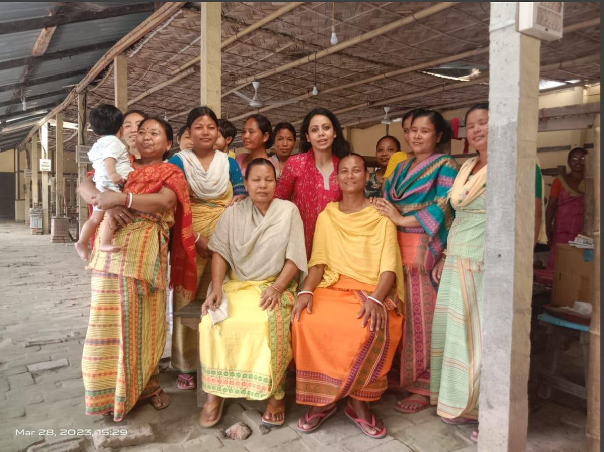 Anushka Das with community of Bodo weavers Anushka Das with community of Bodo weavers