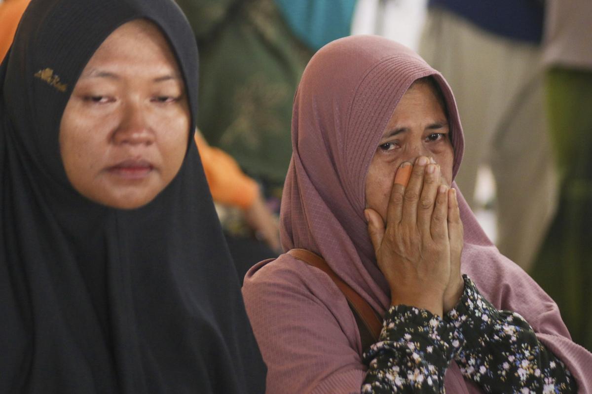 A passenger’s relative weeps after a ferry carrying dozens of passengers sank near the resort island of Bali, at Ketapang Port in Bayuwangi, East Java, Indonesia on July 3, 2025. A passenger’s relative weeps after a ferry carrying dozens of passengers sank near the resort island of Bali, at Ketapang Port in Bayuwangi, East Java, Indonesia on July 3, 2025.