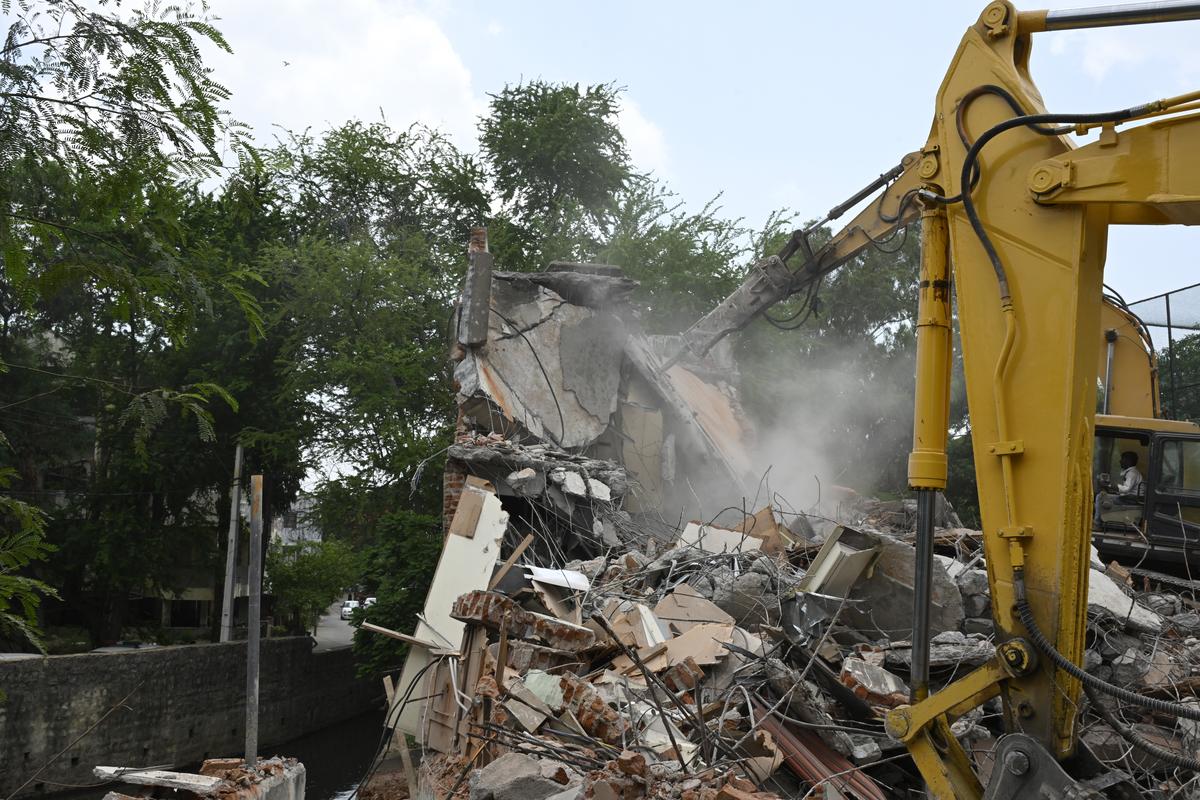 HYDRAA officials demolish commercial structures illegally built over the stormwater nala at Patny Center, in Secunderabad on June 6, 2025.