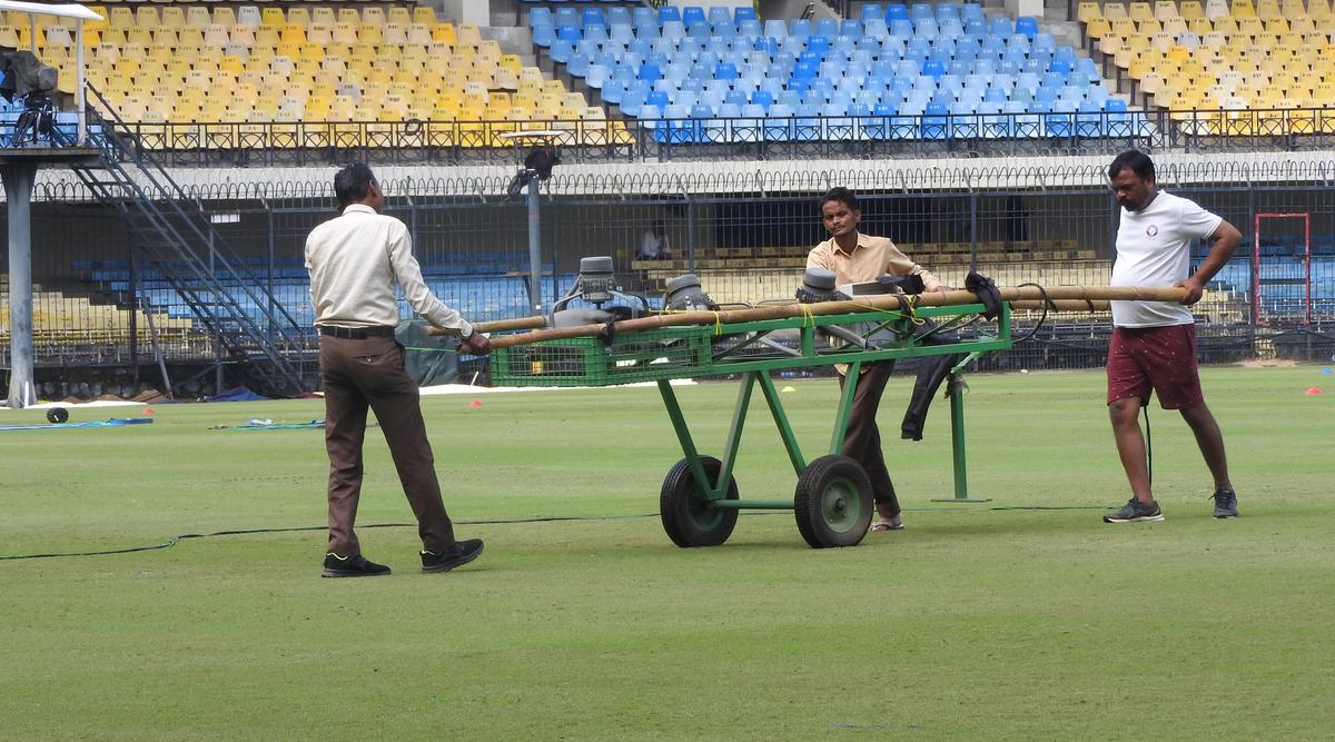 The groundstaff at Indore’s Holkar Stadium using innovative methods to dry out damp spots.