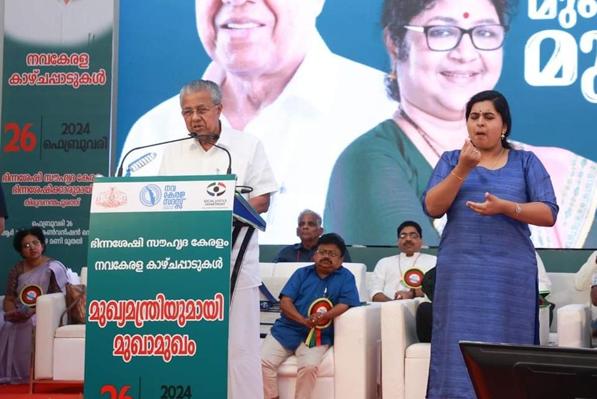 Sign language interpreter S Vyshnevi Maya interpreting for Chief Minister Pinarayi Vijayan at an event