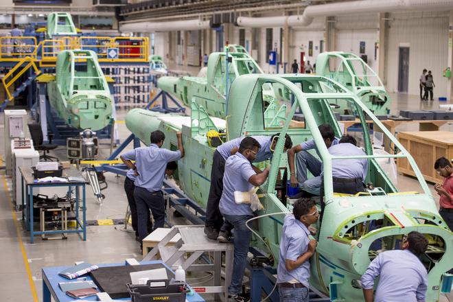 Employees at the Tata Boeing Aerospace Limited, working on aero-structures for AH-64 Apache attack helicopters, in Hyderabad.