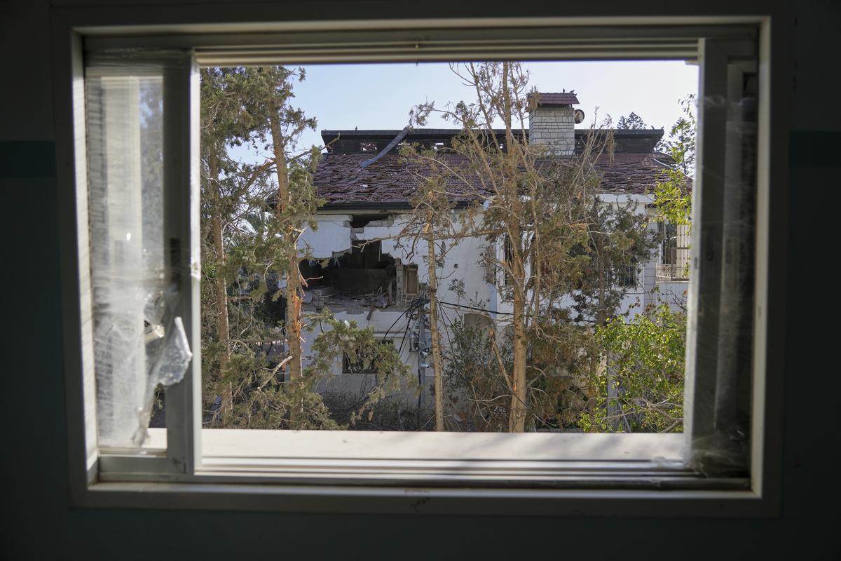 The impact of a projectile is visible on the wall of the U.N. guesthouse, where United Nations workers were located when the building was struck, leaving one staff member dead and five others injured in Deir al-Balah, central Gaza, on March 19, 2025. The impact of a projectile is visible on the wall of the U.N. guesthouse, where United Nations workers were located when the building was struck, leaving one staff member dead and five others injured in Deir al-Balah, central Gaza, on March 19, 2025.