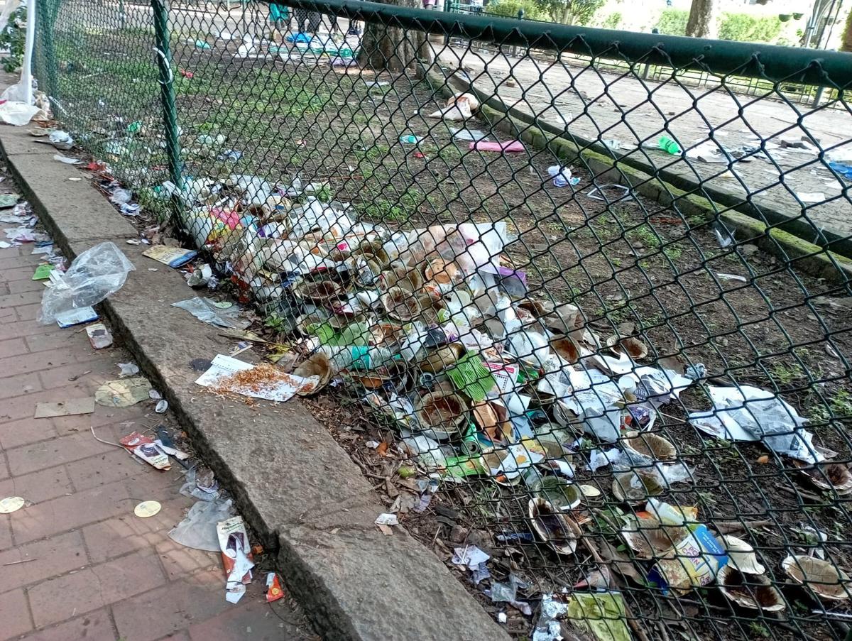 Garbage dumped in and around Lalbagh after the heavy turnout over the  weekend to witness annual flower show at Lalbagh on Independance Day in Bengaluru.