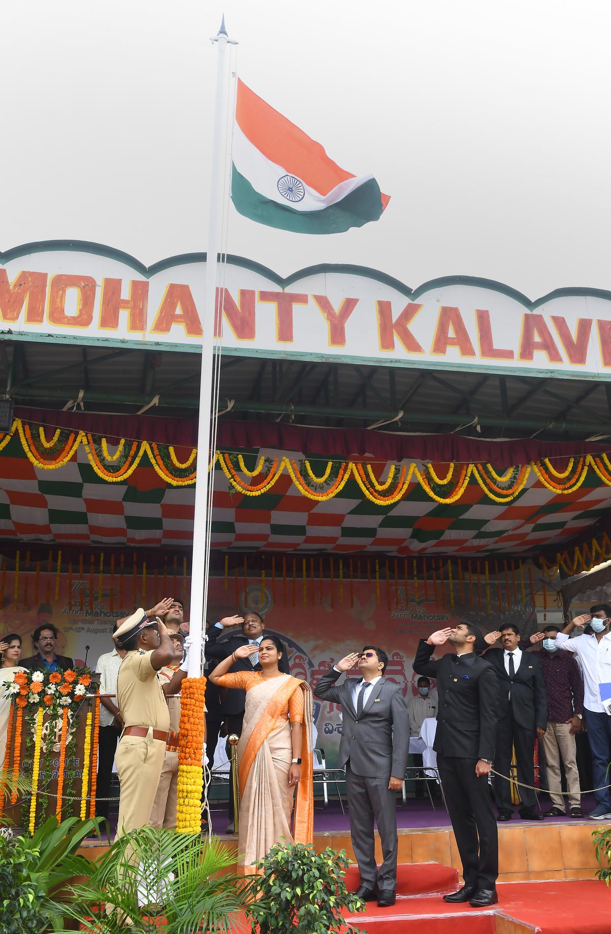 Health minister and district in-charge minister Vidala Rajani salutes after unfurling the national flag at Police Barrack Ground in Visakhapatnam on Monday. 