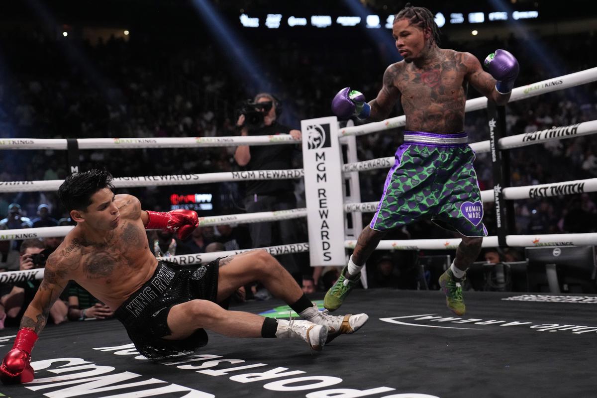 Gervonta Davis knocks down Ryan Garcia during a lightweight boxing bout on April 22, 2023, in Las Vegas. 
