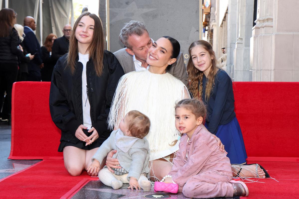 Actor Gal Gadot poses with her family during the unveiling ceremony for her star on the Hollywood Walk of Fame in Los Angeles, California, U.S., March 18, 2025.  