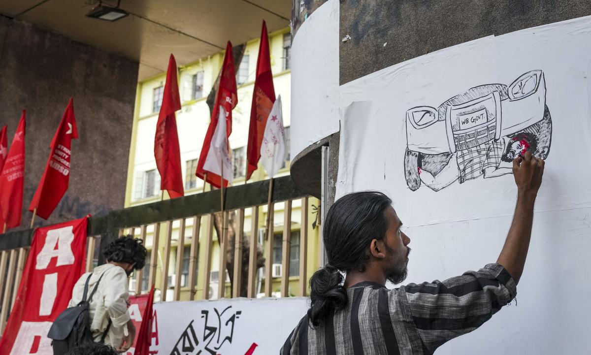 A Students’ Federation of India (SFI) member makes a picture of the students who were injured when a car in the convoy of Education Minister Bratya Basu grazed past them during a melee in Jadavpur University (JU), amid a strike demanding Basu’s resignation, at JU gate, in Kolkata, Monday, March 3, 2025. 