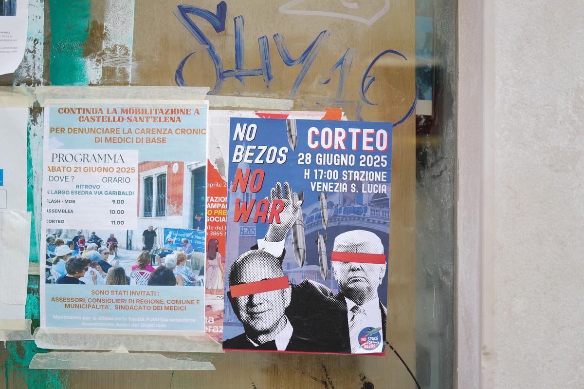 A “No Bezos No War” poster in Venice streets during the Jeff Bezos and Lauren Sanchez wedding on June 27, 2025 in Venice, Italy. The ‘No Space for Bezos’ committee opposed the rental of some part of the city of Venice for the wedding A “No Bezos No War” poster in Venice streets during the Jeff Bezos and Lauren Sanchez wedding on June 27, 2025 in Venice, Italy. The ‘No Space for Bezos’ committee opposed the rental of some part of the city of Venice for the wedding