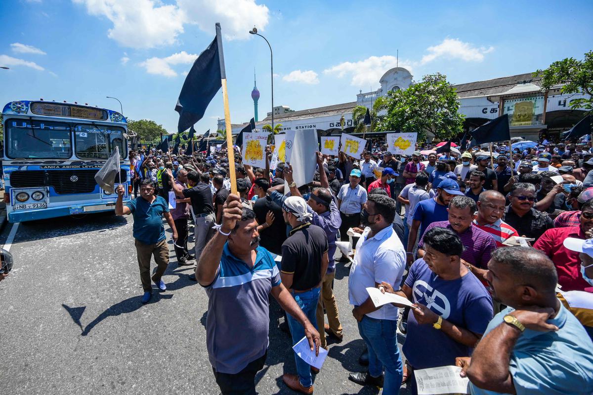 Activists from anti-government trade unions take part in a protest demanding tax reforms, outside the ports authority in Colombo in February.