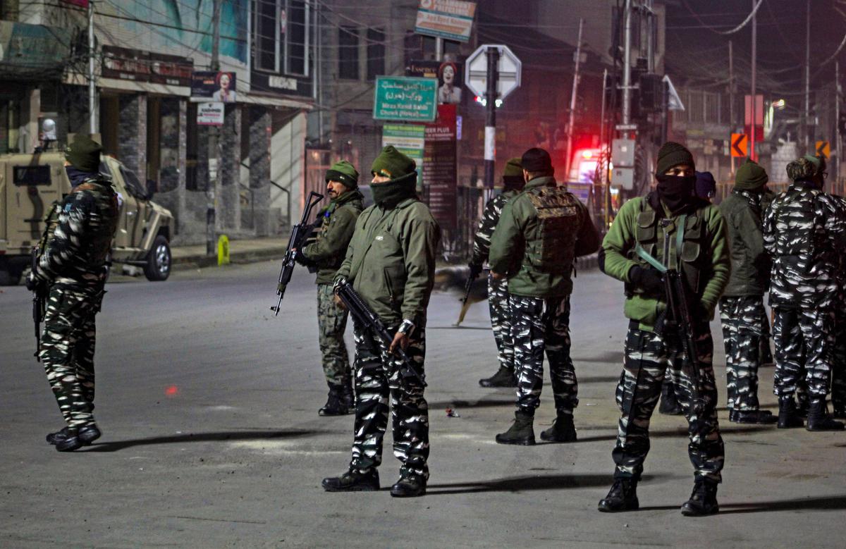 Security personnel cordon off an area after a grenade reportedly hurled towards a CRPF bunker, at Hawal in Srinagar, Sunday, Jan. 1, 2023. 