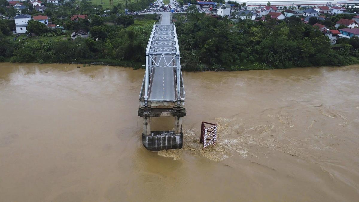 Vietnam storm deaths rise to 64 as a bridge collapses and flooding sweeps away a bus