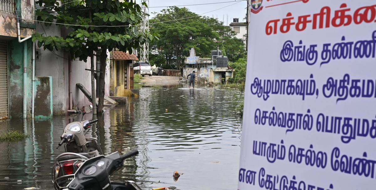 The police department has put up a banner prohibiting residents of Anjaneyar Koil Street at Consalpet in Vellore city from entering the stagnant rainwater on October 24, 2025. Fire and Rescue Services personnel evacuated the residents.
