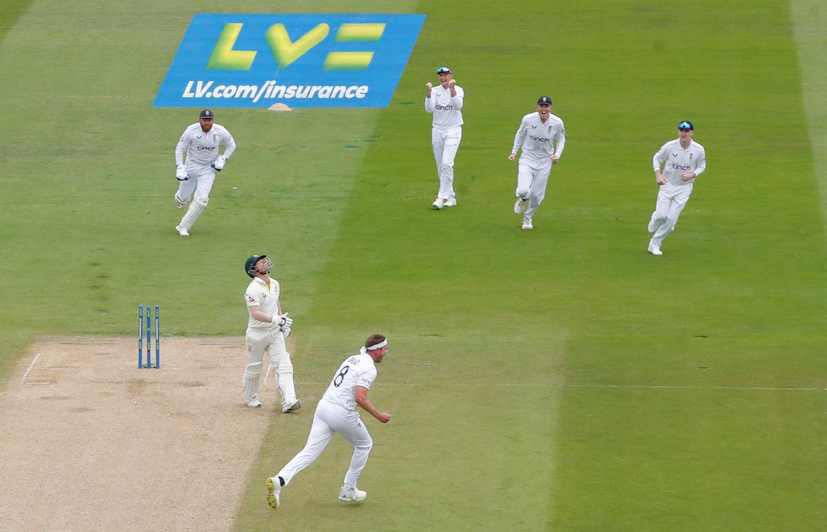 England’s Stuart Broad celebrates after taking the wicket of Australia’s David Warner. 