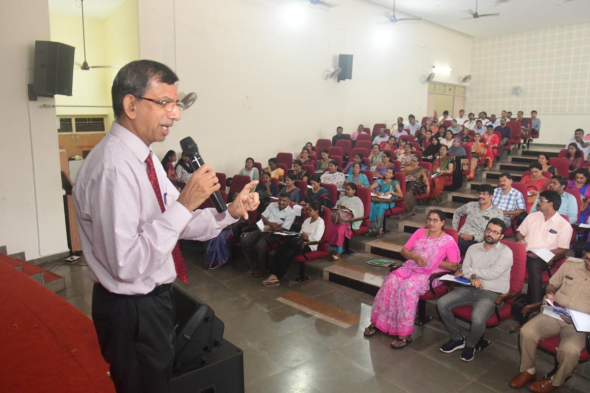 Dr. Ravish Thunga, Consultant and Director, Manaswini, Thunga Institute of Psychiatry and Counselling interacting with officials at a workshop as part of drug-free DK campaign at Eric Mathias Hall, St Aloysius College.