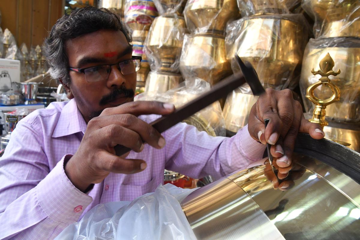 K Arivazhagan, who works in front of Anitha Stores, can engrave motifs such as peacocks and flowers