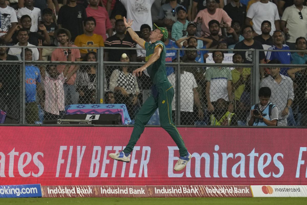 South Africa’s Marco jumps to unsuccessfully take a catch at the boundary line off a shot from England’s Gus Atkinson during the ICC Men’s Cricket World Cup match between South Africa and England in Mumbai, on Oct. 21, 2023.