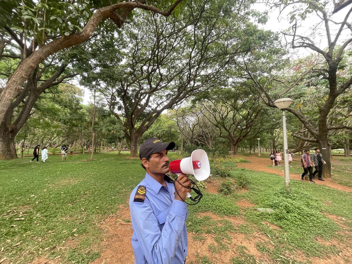  A security guard on patrol at Cubbon Park cautions people to keep the park clean, not to go into the bush due to the snakes and to maintain distance while sitting around the trees or on the benches
