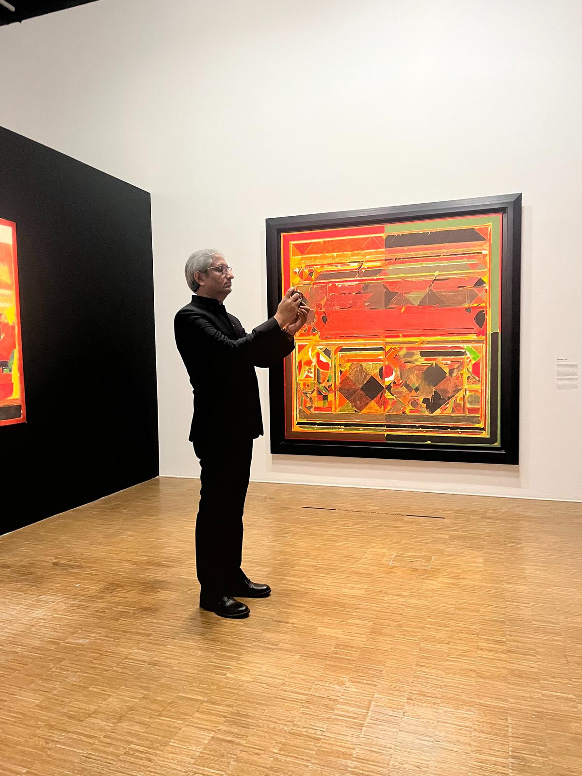 Magsaysay awardee and journalist Ravish Kumar takes in the Raza paintings on display at Centre Pompidou.
