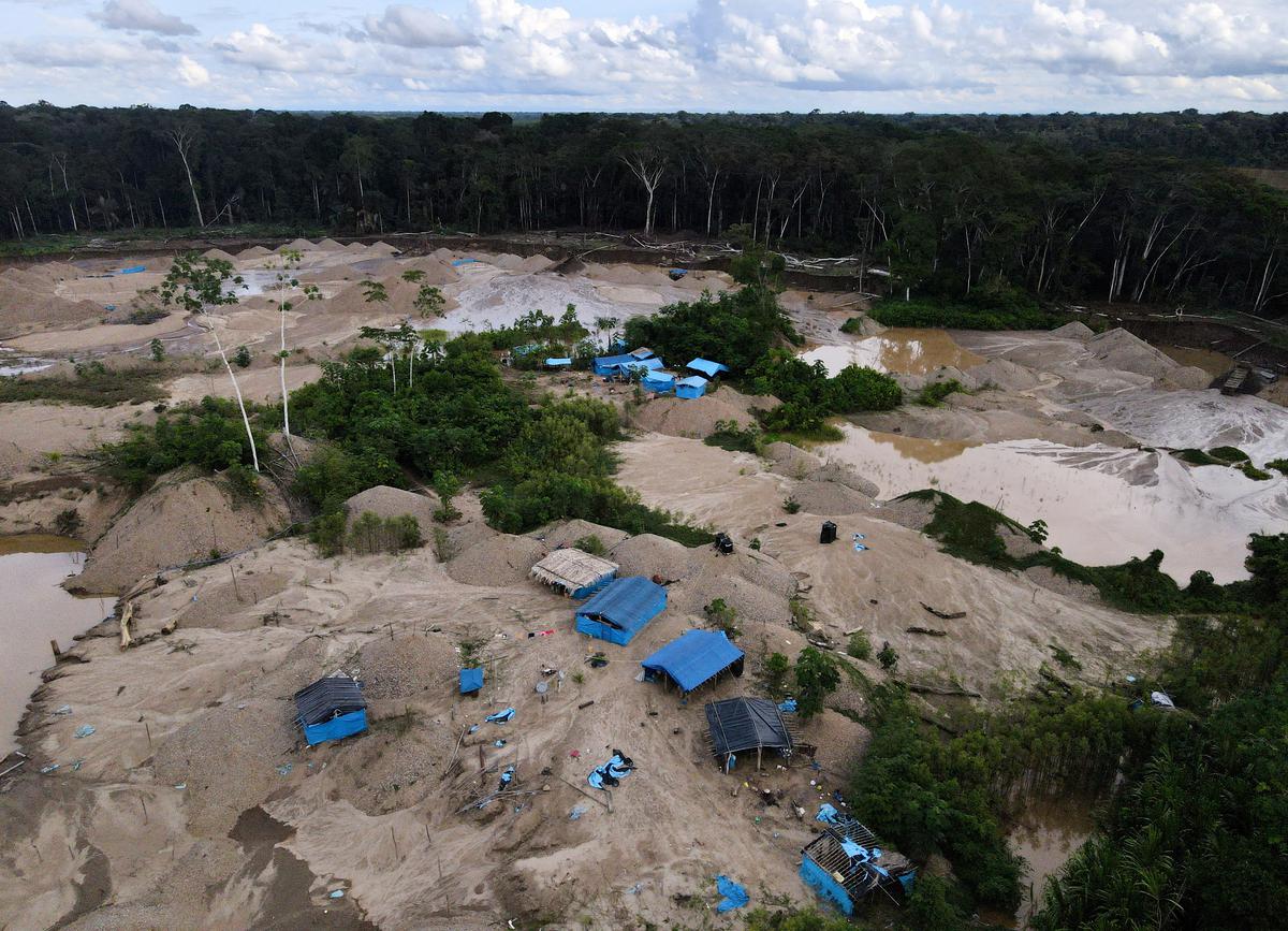 A camp of informal gold miners is pictured in Los Amigos, in the Madre de Dios region, Peru. File