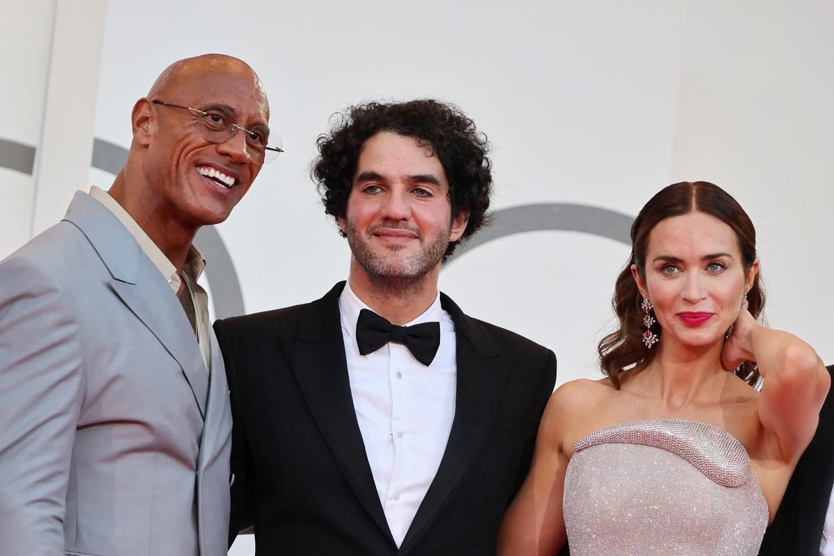 Director Benny Safdie and cast members Dwayne Johnson and Emily Blunt pose on the red carpet during arrivals for the screening “The Smashing Machine” in competition, at the 82nd Venice Film Festival, Venice, Italy, September 1, 2025.