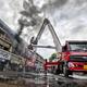 Firefighters try to douse a blaze that broke out in a shop at the Sector 22 mobile market, in Chandigarh, on March 18, 2026.