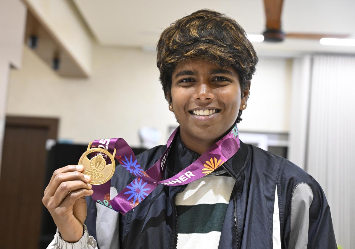 Arundhati Reddy proudly shows her medal after India clinched the women's ODI World Cup. 