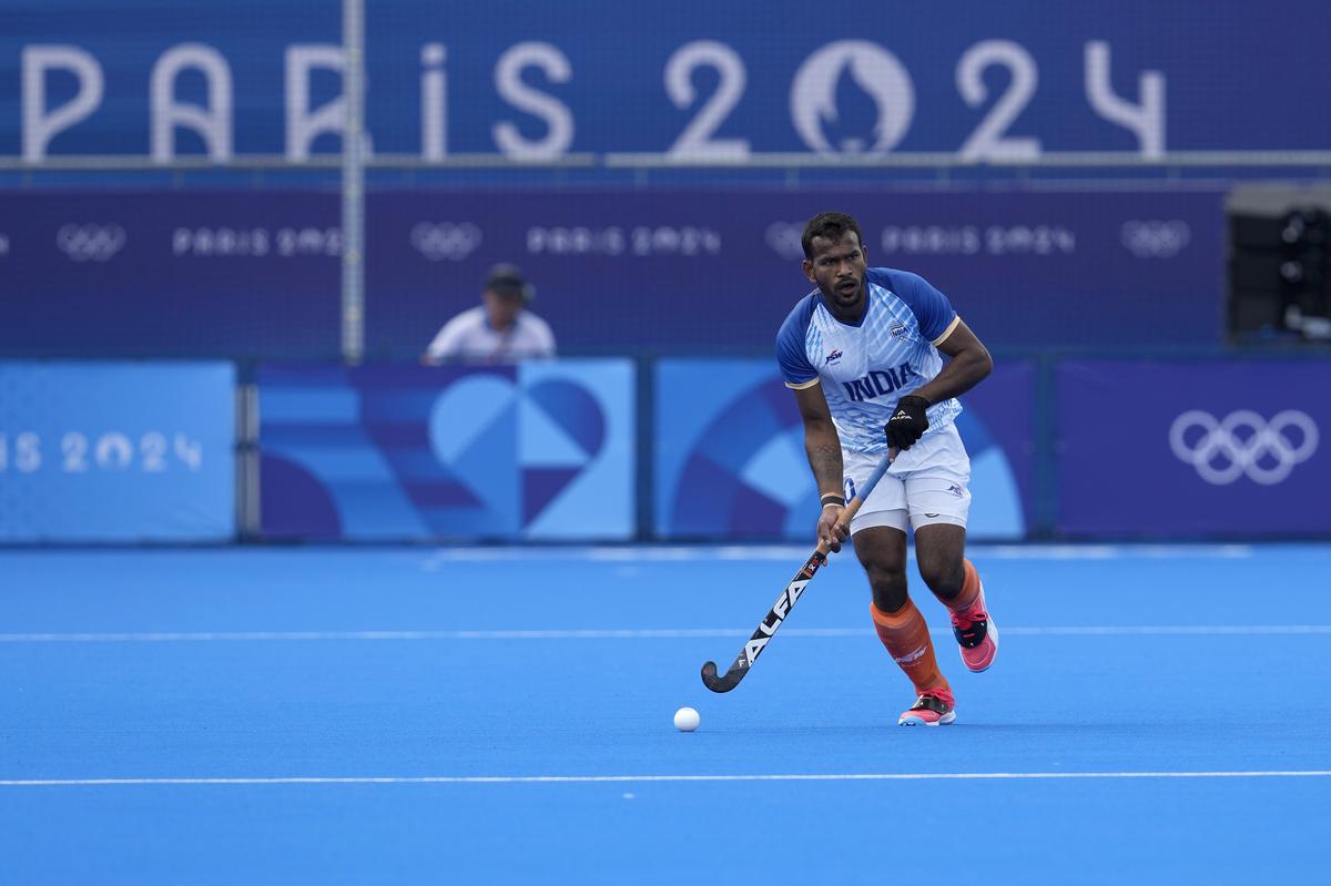 India’s Amit Rohidas drives the ball during the men’s quarterfinal field hockey match between Britain and India at the Yves-du-Manoir Stadium during the 2024 Summer Olympics, Sunday, Aug. 4, 2024, in Colombes, France. 